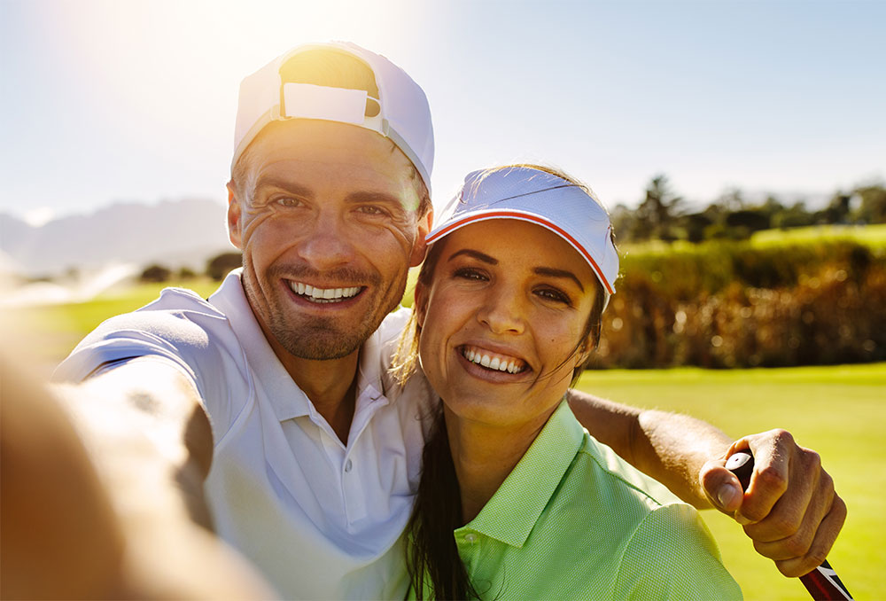 couple taking selfie at golf course