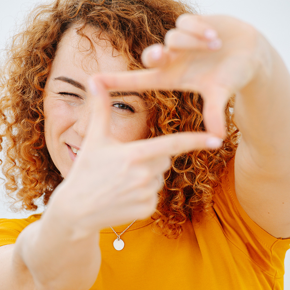 Traveler framing her face